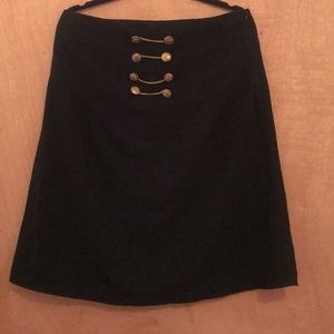 Black skirt with gold buttons and chains